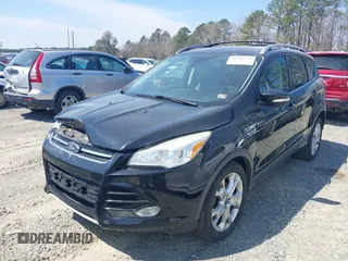 2016 Ford Escape Titanium with VIN 1FMCU0JX8GUC06601, listed as a IAAI auction lot 41785774 with 121,427 mi miles. Bid and sale history available at carsss.com. Image 2.