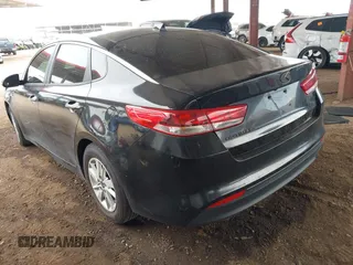 2016 Kia Optima LX with VIN KNAGT4L32G5111503, listed as a IAAI auction lot 42011975 with 114,476 mi miles. Bid and sale history available at carsss.com. Image 3.