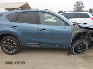 2016 Mazda CX-5 Grand Touring with VIN JM3KE2DY7G0875678, listed as a IAAI auction lot 42104888 with 30,566 mi miles. Bid and sale history available at carsss.com. Image 14.
