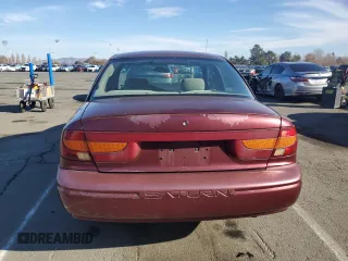 2001 Saturn SL z VIN 1G8ZK54731Z305098, wystawiony jako Copart lot #83875424 z przebiegiem 82 879 mil mil oraz Tytuł czysty. Historia ofert i sprzedaży dostępna na DreamBid. Obrazek 6.