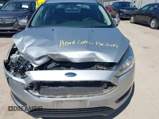 2017 Ford Focus SE z VIN 1FADP3F21HL237412, wystawiony jako IAAI lot #42188886 z przebiegiem 148 355 mil mil oraz . Historia ofert i sprzedaży dostępna na DreamBid. Obrazek 6.