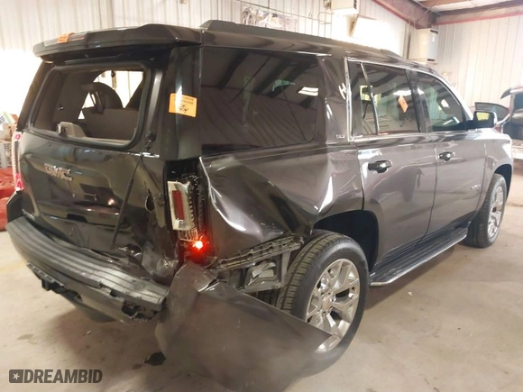 2016 GMC Yukon SLT with VIN 1GKS2BKC8GR277799, listed as a IAAI auction lot 41400549 with 91,139 mi miles. Bid and sale history available at carsss.com. Image 4.