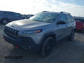 2015 Jeep Cherokee Trailhawk with VIN 1C4PJMBS3FW662307, listed as a IAAI auction lot 41778932 with 64,569 mi miles. Bid and sale history available at carsss.com. Image 17.