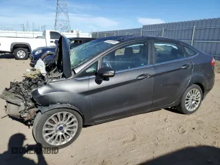 2016 Ford Fiesta Titanium z VIN 3FADP4CJ5GM117918, wystawiony jako Copart lot #84995794 z przebiegiem Nie podano mil oraz Szkoda całkowita • Salvage title. Historia ofert i sprzedaży dostępna na DreamBid. Obrazek 1.