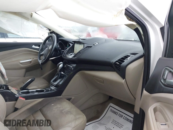 2016 Ford Escape Titanium with VIN 1FMCU9JX9GUA62674, listed as a IAAI auction lot 41838996 with 135,105 mi miles. Bid and sale history available at carsss.com. Image 5.