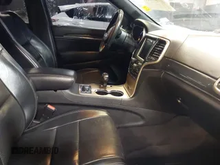 2015 Jeep Grand Cherokee Overland with VIN 1C4RJFCG1FC215426, listed as a IAAI auction lot 41689821 with 128,563 mi miles. Bid and sale history available at carsss.com. Image 5.