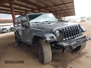 2020 Jeep Wrangler Unlimited Black and Tan with VIN 1C4HJXDG3LW266615, listed as a IAAI auction lot 42207899 with 55,291 mi miles and . Bid and sale history available at DreamBid. Image 1.