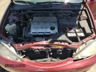 2003 Toyota Camry LE z VIN 4T1BF30K23U056007, wystawiony jako Copart lot #55187435 z przebiegiem 233 976 mil mil oraz Czysty tytuł • Clean title. Historia ofert i sprzedaży dostępna na DreamBid. Obrazek 11.
