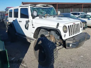 2016 Jeep Wrangler Unlimited Sahara with VIN 1C4BJWEG5GL243004, listed as a IAAI auction lot 40438321 with 121,360 mi miles and . Bid and sale history available at DreamBid. Image 1.