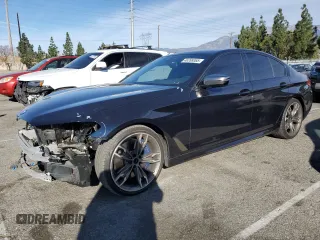 2020 BMW 5 Series M550i xDrive z VIN WBAJS7C06LBN96210, wystawiony jako Copart lot #46769365 z przebiegiem 39 710 mil mil oraz Szkoda całkowita • Salvage title. Historia ofert i sprzedaży dostępna na DreamBid. Obrazek 1.