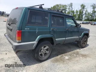 1999 Jeep Cherokee Sport with VIN 1J4FF68S2XL570795, listed as a Copart auction lot 61860585 with 320,467 mi miles and Salvage title. Bid and sale history available at DreamBid. Image 3.
