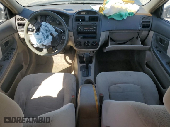 2004 Kia Spectra LX with VIN KNAFE121X45021922, listed as a Copart auction lot 49989845 with 184,189 mi miles and Salvage Title. Bid and sale history available at carsss.com. Image 8.