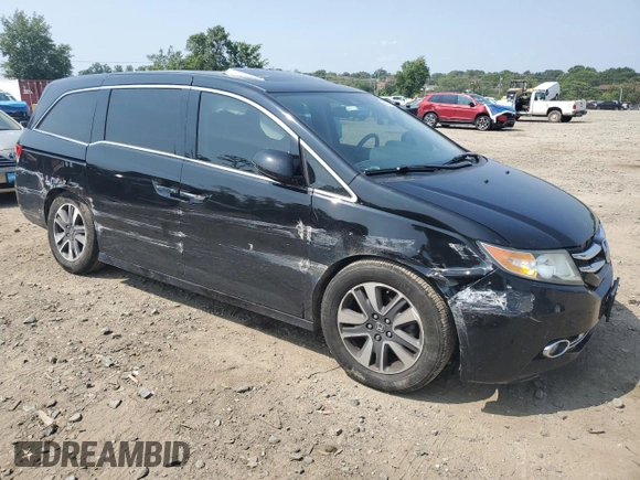 2014 Honda Odyssey Touring with VIN 5FNRL5H91EB015162, listed as a Copart auction lot 60643135 with 176,898 mi miles and Salvage title. Bid and sale history available at DreamBid. Image 4.