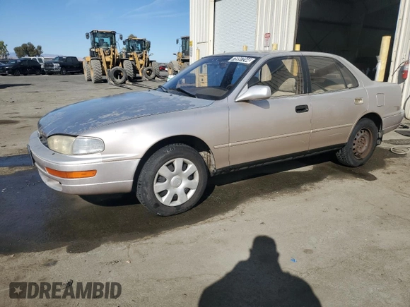 1994 Toyota Camry LE z VIN JT2GK12EXR0070117, wystawiony jako Copart lot #75997244 z przebiegiem 185 759 mil mil oraz Czysty tytuł • Clean title. Historia ofert i sprzedaży dostępna na DreamBid. Obrazek 1.