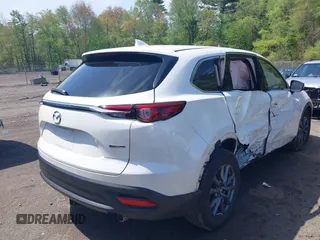 2021 Mazda CX-9 Touring z VIN JM3TCBCYXM0521323, wystawiony jako IAAI lot #42190976 z przebiegiem 56 652 mil mil oraz . Historia ofert i sprzedaży dostępna na DreamBid. Obrazek 4.