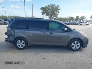 2014 Toyota Sienna LE AAS with VIN 5TDKK3DCXES432611, listed as a IAAI auction lot 40771635 with 214,145 mi miles and . Bid and sale history available at carsss.com. Image 14.