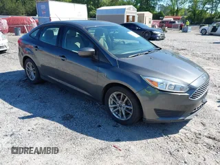 2018 Ford Focus SE z VIN 1FADP3FE1JL238012, wystawiony jako IAAI lot #42185232 z przebiegiem 143 687 mil mil oraz . Historia ofert i sprzedaży dostępna na DreamBid. Obrazek 1.