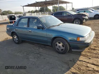 1992 Mazda 626 z VIN 1YVGD22B5N5212605, wystawiony jako Copart lot #74945704 z przebiegiem 99 659 mil mil oraz Tytuł czysty. Historia ofert i sprzedaży dostępna na DreamBid. Obrazek 4.