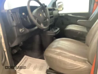 2014 Chevrolet Express Cargo Van with VIN 1GCSGAFXXE1154019, listed as a IAAI auction lot 41989495 with 303,623 mi miles. Bid and sale history available at carsss.com. Image 1.