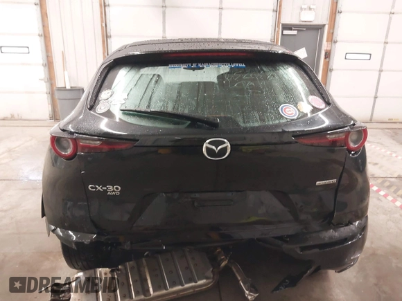 2021 Mazda CX-30 S with VIN 3MVDMBAL2MM265207, listed as a IAAI auction lot 41566325 with 62,587 mi miles and . Bid and sale history available at carsss.com. Image 16.