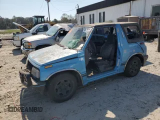 1995 Geo Tracker z VIN 2CNBE18UXS6930601, wystawiony jako Copart lot #83043754 z przebiegiem 276 136 mil mil oraz Szkody całkowita. Historia ofert i sprzedaży dostępna na DreamBid. Obrazek 1.