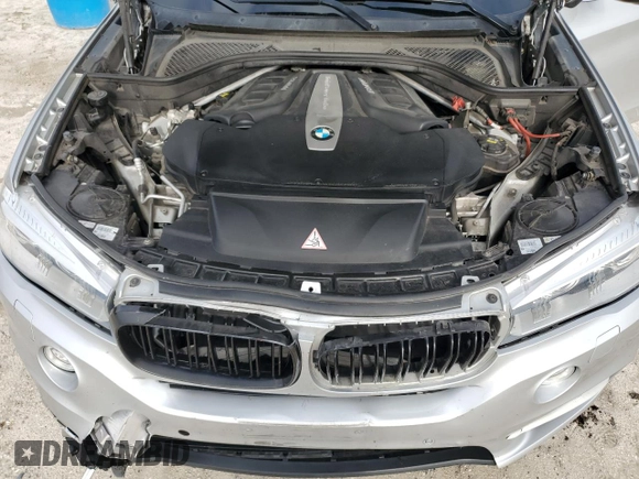 2015 BMW X5 xDrive50i with VIN 5UXKR6C51F0J74160, listed as a Copart auction lot 79337044 with 143,436 mi miles and Salvage title. Bid and sale history available at DreamBid. Image 14.