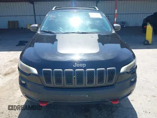 2019 Jeep Cherokee Trailhawk Elite with VIN 1C4PJMBX0KD198328, listed as a IAAI auction lot 42085194 with 76,312 mi miles and . Bid and sale history available at DreamBid. Image 13.