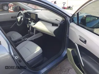 2023 Toyota Corolla Cross L with VIN 7MUAAAAG4PV044969, listed as a IAAI auction lot 42388727 with 26,071 mi miles and . Bid and sale history available at DreamBid. Image 5.