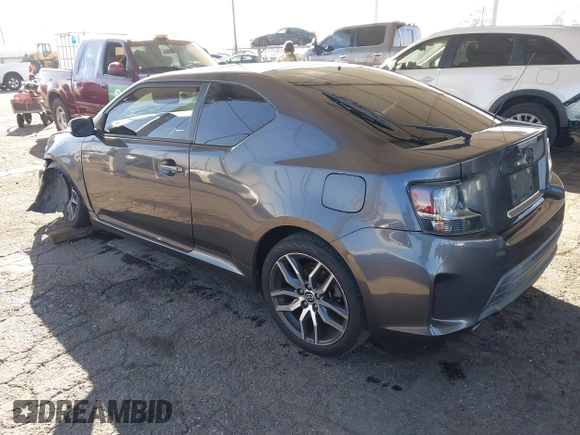2016 Scion tC with VIN JTKJF5C78GJ014184, listed as a IAAI auction lot 41622575 with 128,520 mi miles. Bid and sale history available at carsss.com. Image 3.