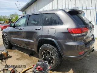 2017 Jeep Grand Cherokee Trailhawk with VIN 1C4RJFLGXHC654112, listed as a Copart auction lot 56397195 with 168,136 mi miles and Salvage title. Bid and sale history available at DreamBid. Image 2.