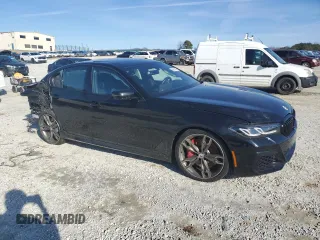 2023 BMW 5 Series M550i xDrive z VIN WBA13BK08PCM88687, wystawiony jako Copart lot #88633545 z przebiegiem Nie podano mil oraz Szkoda całkowita • Salvage title. Historia ofert i sprzedaży dostępna na DreamBid. Obrazek 4.