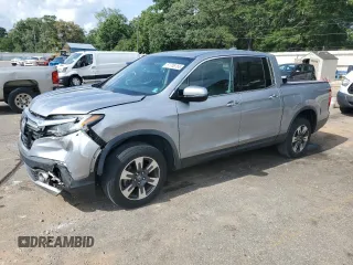 2019 Honda Ridgeline RTL-E with VIN 5FPYK3F72KB001049, listed as a Copart auction lot 57706765 with 97,722 mi miles and Salvage title. Bid and sale history available at DreamBid. Image 1.