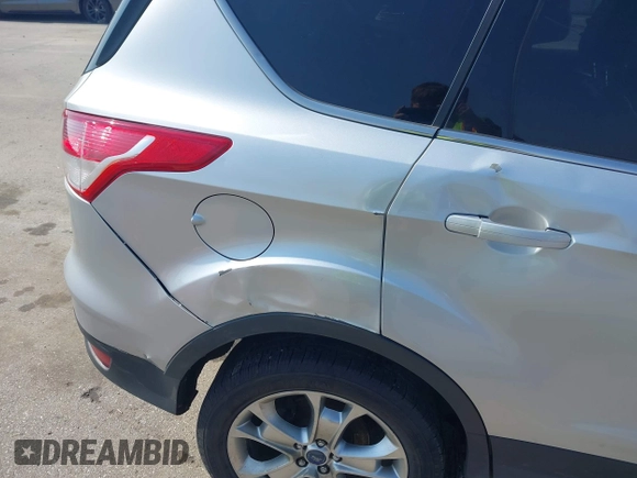 2013 Ford Escape SEL with VIN 1FMCU9H99DUA11243, listed as a IAAI auction lot 42356731 with 154,937 mi miles and . Bid and sale history available at DreamBid. Image 17.