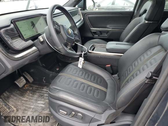2022 Rivian R1S Launch Edition with VIN 7PDSGABL3NN000739, listed as a Copart auction lot 88127995 with 12,143 mi miles and Salvage Title. Bid and sale history available at DreamBid. Image 7.