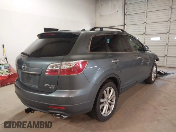 2012 Mazda CX-9 Grand Touring with VIN JM3TB3DV6C0360304, listed as a IAAI auction lot 41509627 with 163,986 mi miles. Bid and sale history available at carsss.com. Image 4.
