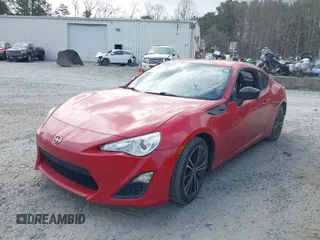 2015 Scion FR-S with VIN JF1ZNAA10F8702616, listed as a IAAI auction lot 41719852 with 95,855 mi miles. Bid and sale history available at carsss.com. Image 2.