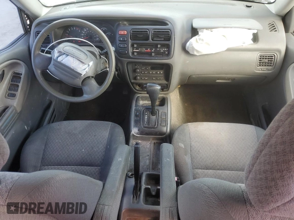 2003 Chevrolet Tracker with VIN 2CNBE13C836953178, listed as a Copart auction lot 60715605 with 128,978 mi miles and Salvage title. Bid and sale history available at DreamBid. Image 8.
