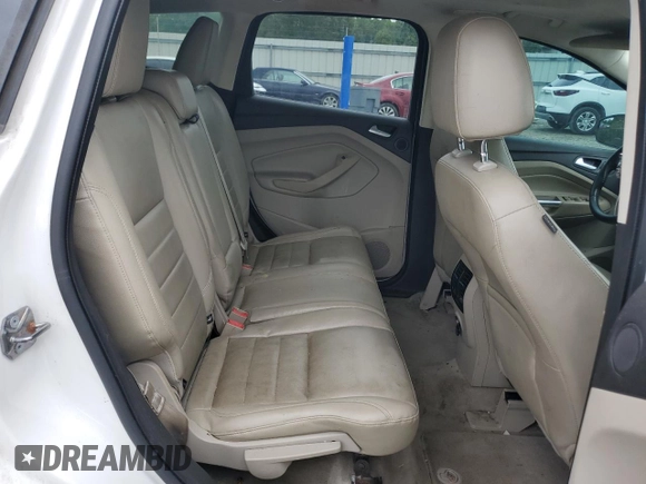 2013 Ford Escape SEL z VIN 1FMCU9HX4DUB05173, wystawiony jako Copart lot #57918125 z przebiegiem 197 195 mil mil oraz Szkoda całkowita • Salvage title. Historia ofert i sprzedaży dostępna na DreamBid. Obrazek 11.