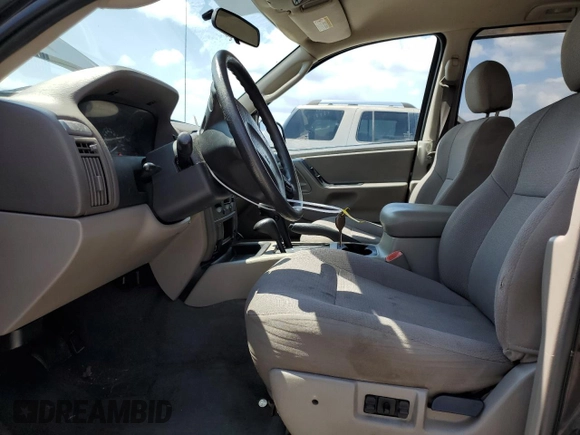 2004 Jeep Grand Cherokee Laredo with VIN 1J4GW48S64C121057, listed as a Copart auction lot 67765474 with 166,359 mi miles and Salvage title. Bid and sale history available at DreamBid. Image 7.