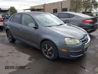 2009 Volkswagen Jetta S z VIN 3VWJZ71K49M053603, wystawiony jako IAAI lot #41785816 z przebiegiem 100 065 mil mil oraz . Historia ofert i sprzedaży dostępna na DreamBid. Obrazek 1.