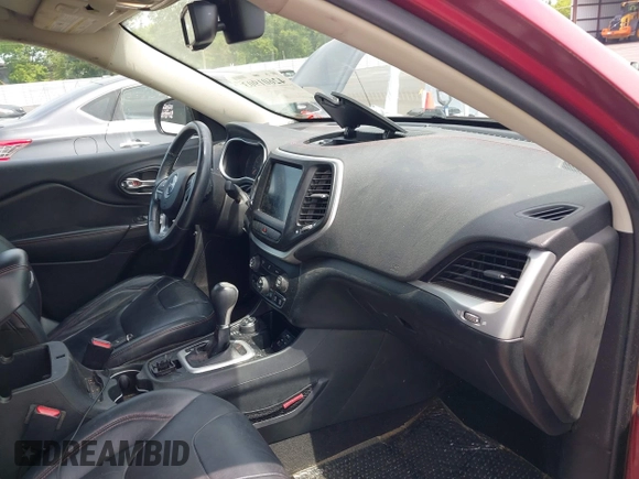 2014 Jeep Cherokee Trailhawk with VIN 1C4PJMBS7EW162357, listed as a IAAI auction lot 42601903 with 104,768 mi miles and . Bid and sale history available at DreamBid. Image 5.