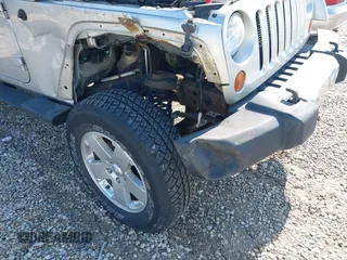 2012 Jeep Wrangler Unlimited Altitude z VIN 1C4HJWEGXCL120397, wystawiony jako IAAI lot #42219976 z przebiegiem 119 172 mil mil oraz . Historia ofert i sprzedaży dostępna na DreamBid. Obrazek 6.