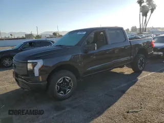 2023 Ford F-150 Lightning Pro with VIN 1FTVW1EL7PWG11261, listed as a Copart auction lot 64088925 with 3,288 mi miles and Salvage title. Bid and sale history available at DreamBid. Image 1.