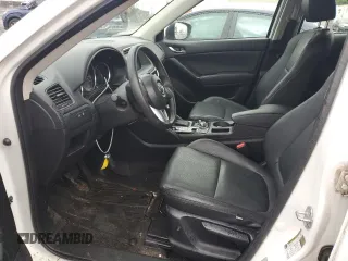 2016 Mazda CX-5 Sport z VIN JM3KE4BY2G0802376, wystawiony jako Copart lot #55976585 z przebiegiem 112 600 mil mil oraz Szkoda całkowita • Salvage title. Historia ofert i sprzedaży dostępna na DreamBid. Obrazek 7.