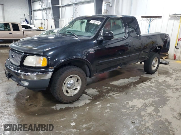 2000 Ford F-150 XL with VIN 1FTRX18L7YNA85909, listed as a Copart auction lot 56056165 with 134,765 mi miles and Salvage title. Bid and sale history available at DreamBid. Image 1.