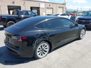 2021 Tesla Model 3 Long Range with VIN 5YJ3E1EB4MF064631, listed as a IAAI auction lot 41424856 with 95,511 mi miles and . Bid and sale history available at DreamBid. Image 4.