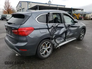 2018 BMW X1 xDrive28i with VIN WBXHT3C33J5K23187, listed as a Copart auction lot 71063192 with 97,403 mi miles. Bid and sale history available at carsss.com. Image 3.