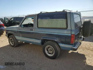 1990 Ford Bronco z VIN 1FMCU12T2LUA31399, wystawiony jako Copart lot #77099614 z przebiegiem 85 663 mil mil oraz Szkoda całkowita • Salvage title. Historia ofert i sprzedaży dostępna na DreamBid. Obrazek 2.
