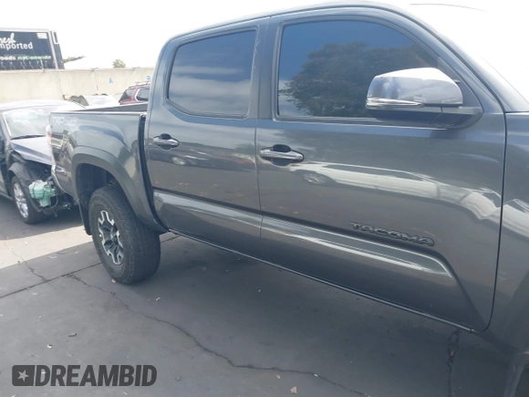 2023 Toyota Tacoma SR with VIN 3TMCZ5AN0PM635933, listed as a IAAI auction lot 42543126 with 32,960 mi miles and . Bid and sale history available at DreamBid. Image 14.