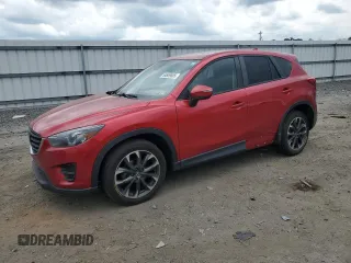 2016 Mazda CX-5 Grand Touring with VIN JM3KE4DY0G0664379, listed as a Copart auction lot 54659005 with 116,022 mi miles and Salvage Title. Bid and sale history available at DreamBid. Image 1.